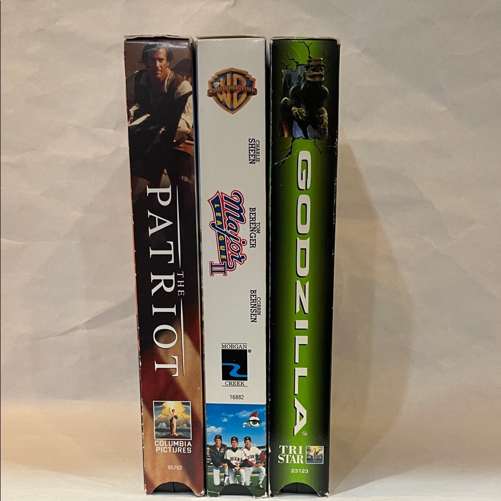 VHS movie set The Patriot, Major League II, and Godzilla